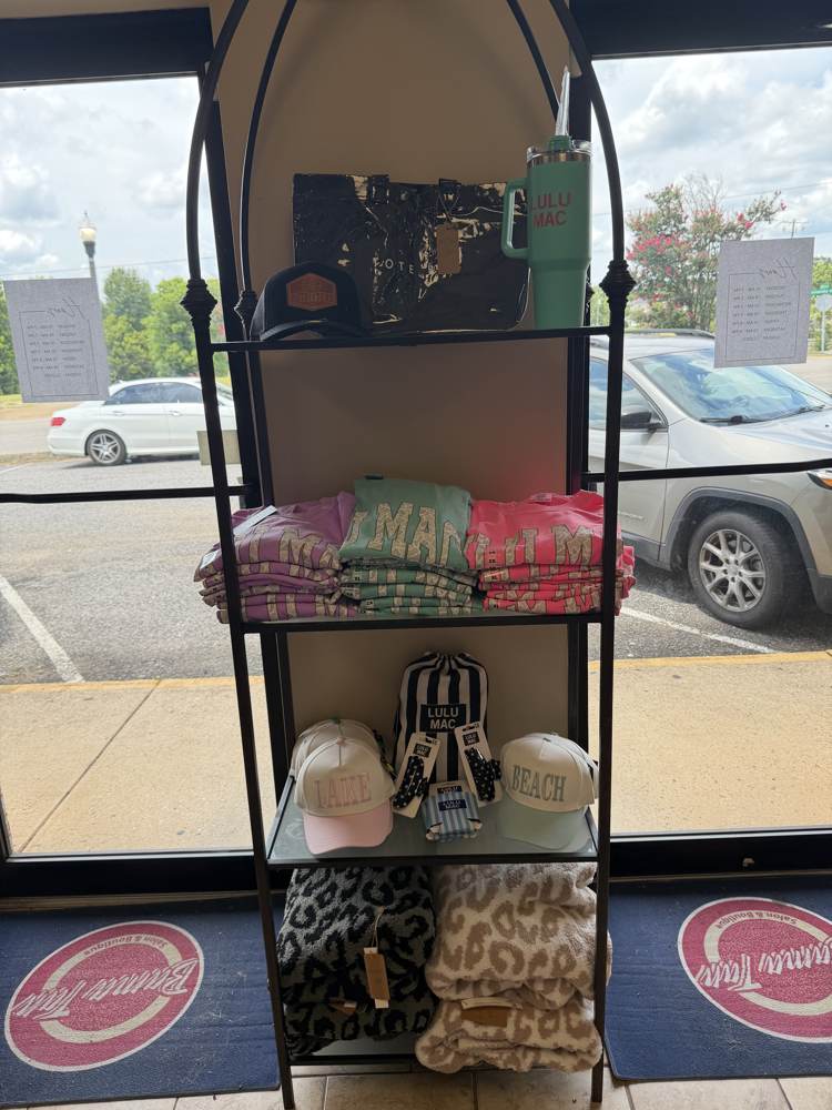 Lulu Mac boutique display with hats, bags and blankets at Bama Tan