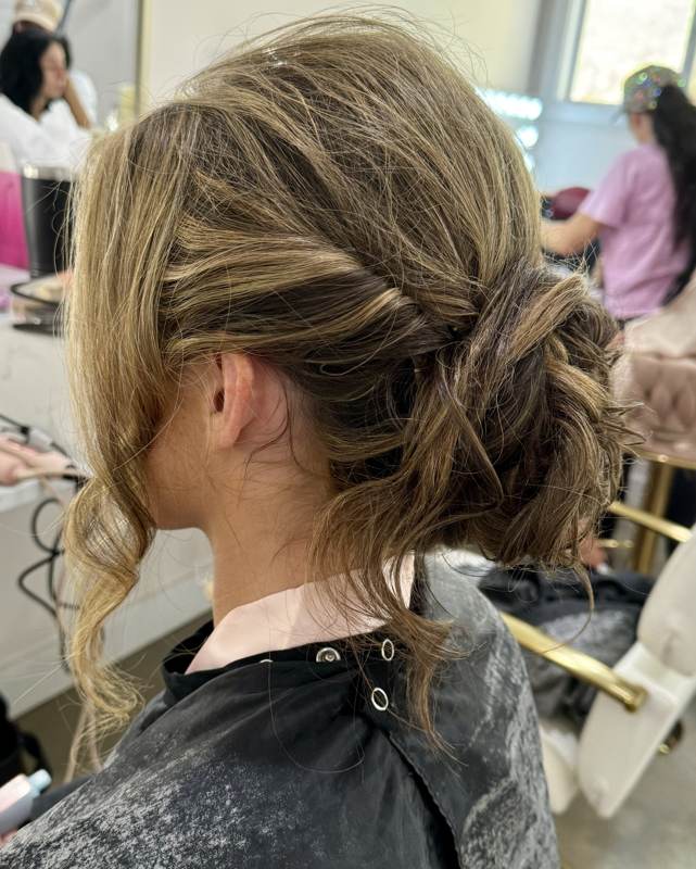 Soft romantic updo hairstyle by Bama Tan Salon stylists