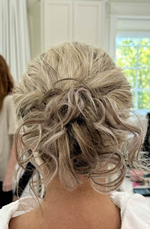 Curled formal updo hairstyle by Bama Tan Salon